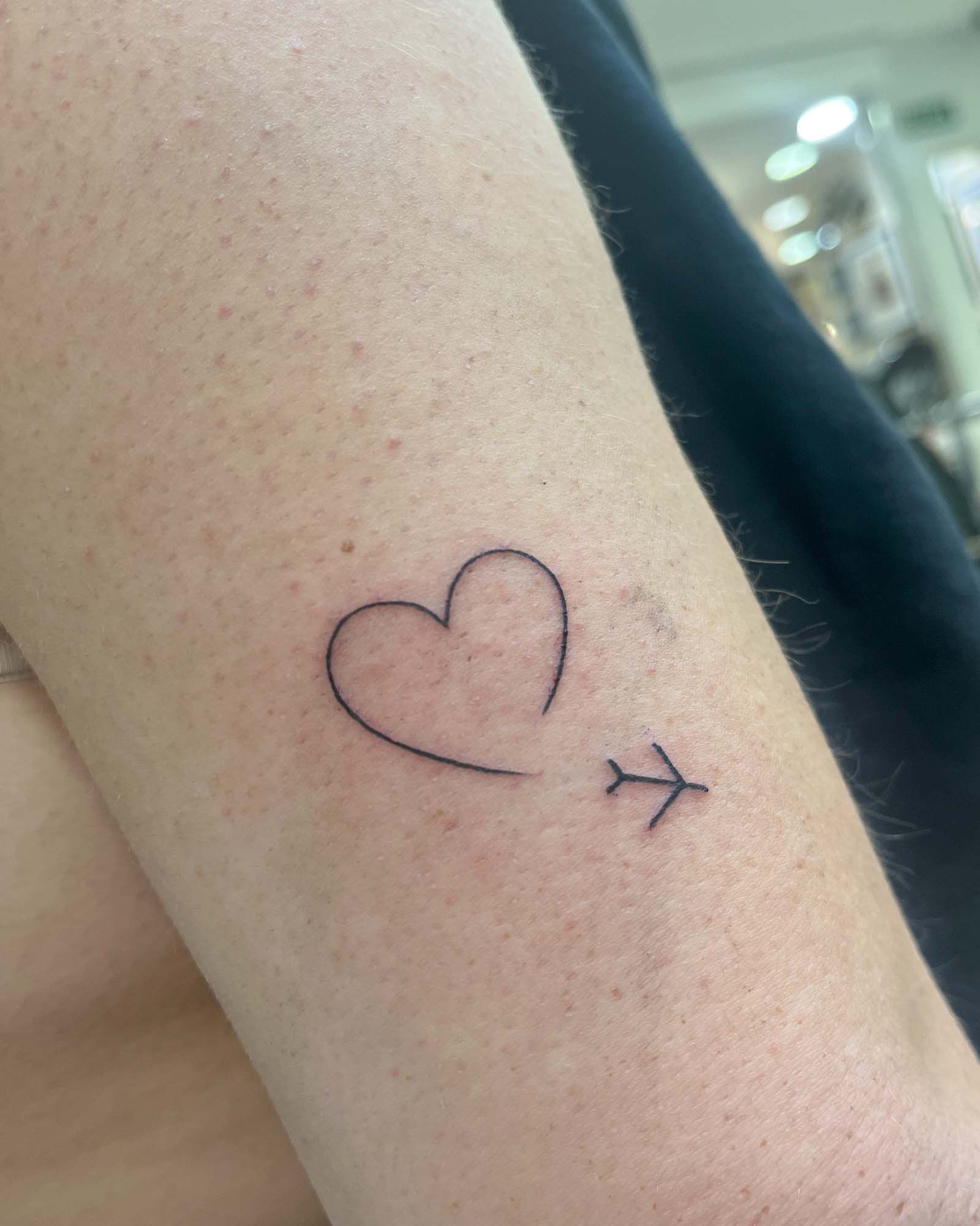 fine line heart airplane tattoo minimalist valencia